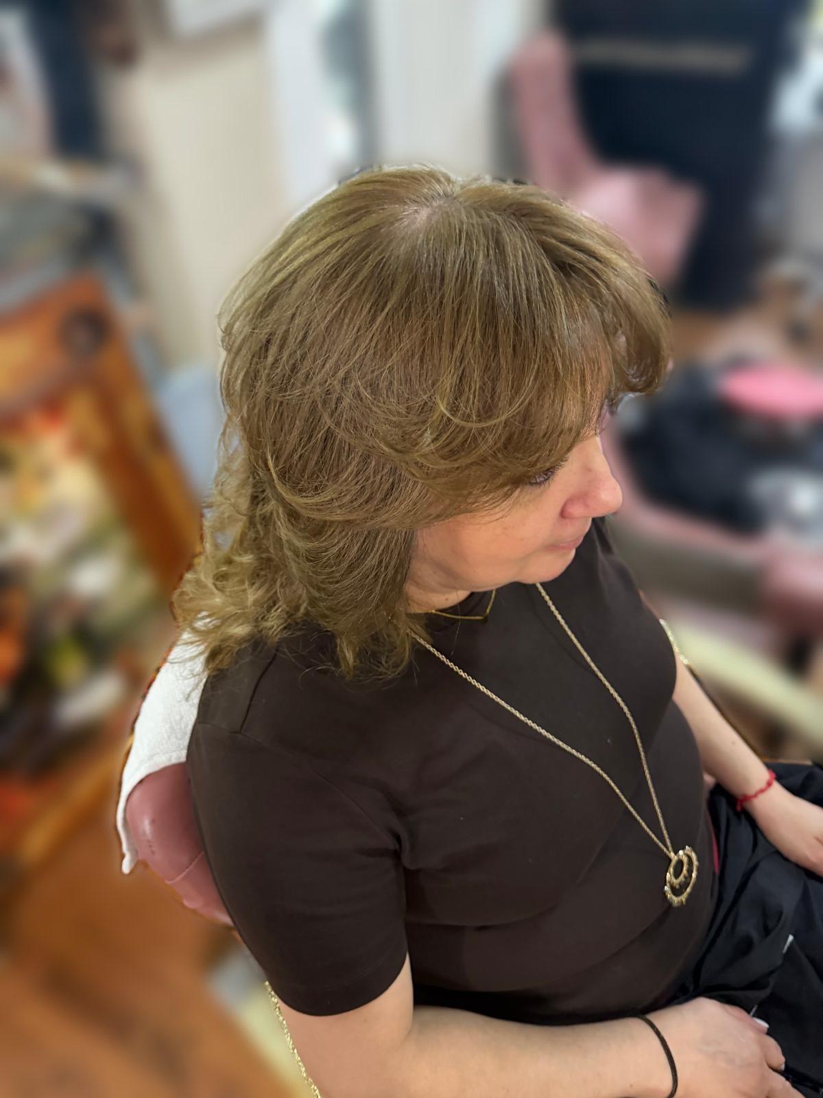 Face-framing layers with curtain bangs and a soft blowout